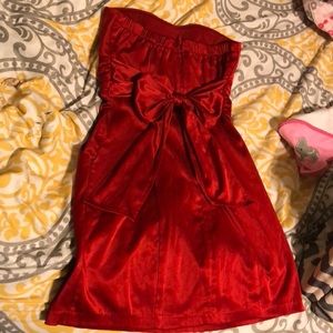 Red satin dress with pockets and bow on the back